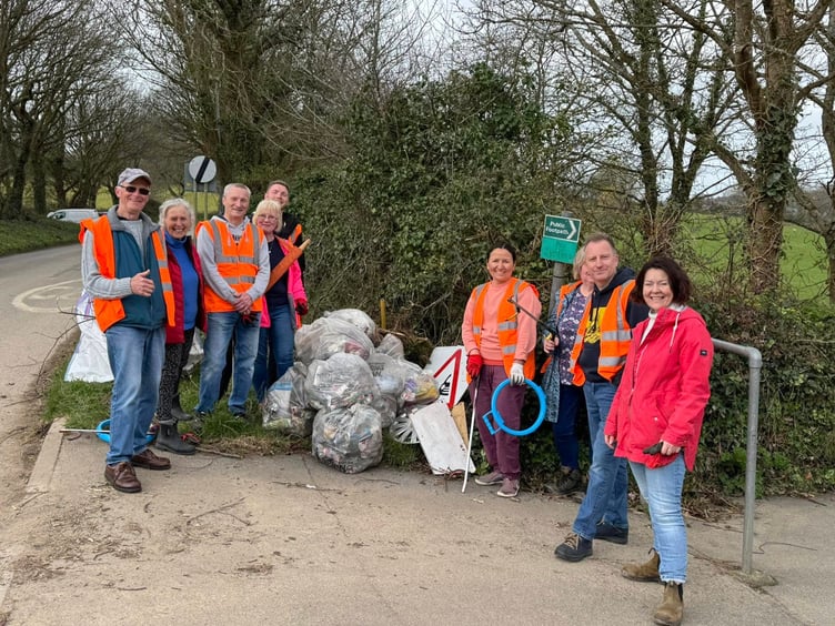 Volunteers with some of the rubbish they picked up and bagged.
