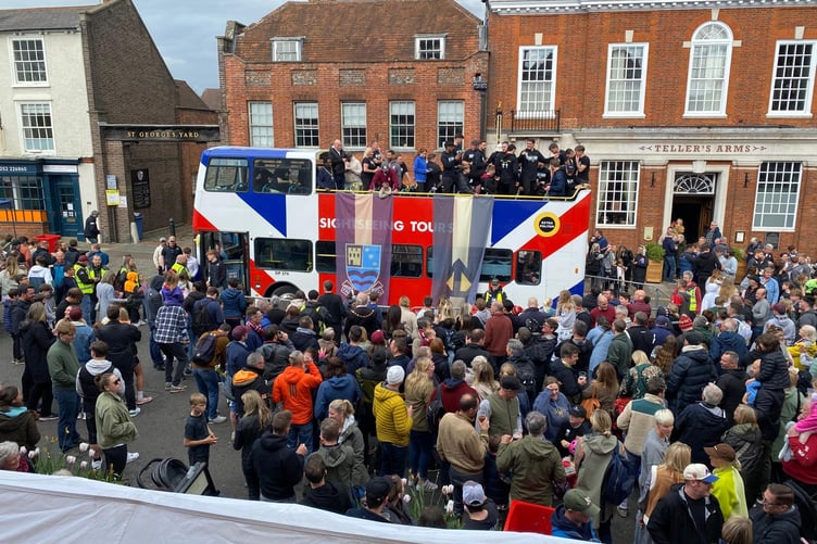 Farnham Town FC celebrate in the town centre.