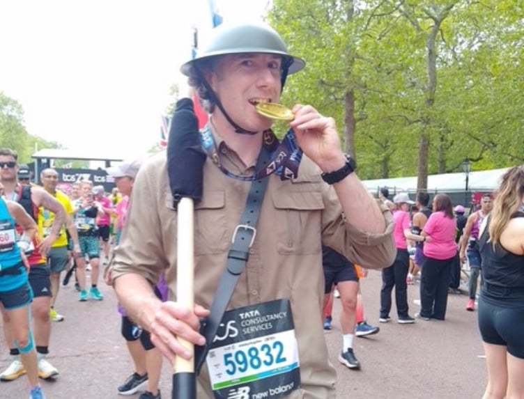 Seadhna with his medal at the London Marathon finish line.