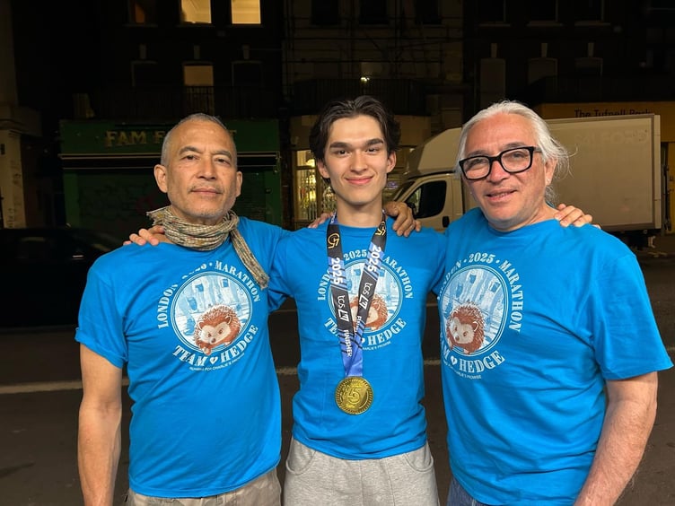 Felix Sulit Tarry, centre, completed the marathon in memory of knife-crime victim Charlie Cosser.