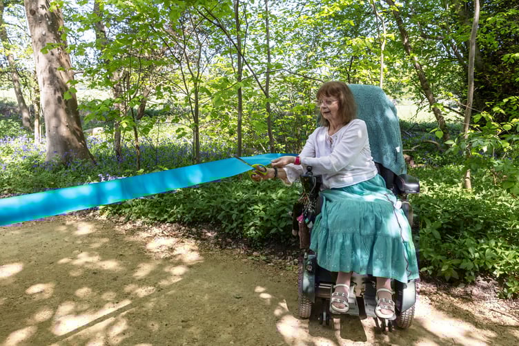 Suzan cuts the ribbon