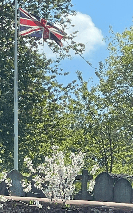 The Union flag was raised at St Petrock's Church, Timberscombe, for VE Day 80th anniversary celebrations.