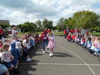Flags, fun and flair at Badshot Lea school's VE Day 80 party