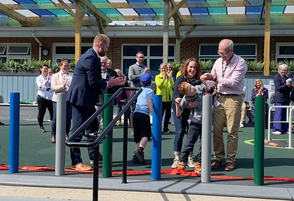<p>The ribbon is dropped to the £475k playground at The Ridgeway School in South Farnham</p>