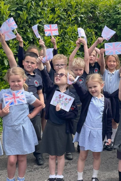 Old Cleeve First School youngsters join in the 80th anniversary of VE Day celebrations.