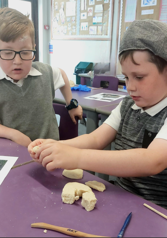 Pupils of St Peter's First School, Williton, make salt dough air raid shelters as they learn about the 80th anniversary of VE Day.