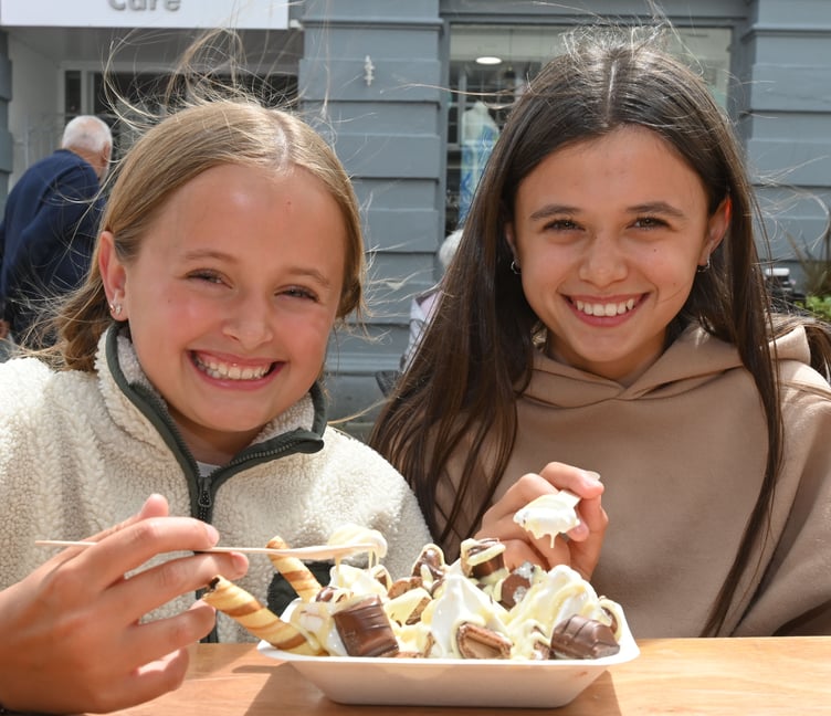 Perfect weather for for Ivy and Molly tucking into a delicious Ice Cream Bueno Tray (Picture: Adrian Jasper)