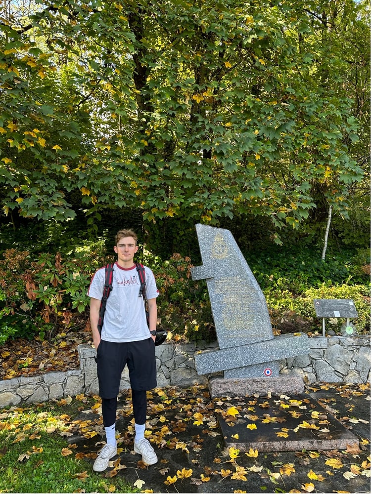 Adam at crash site with memorial