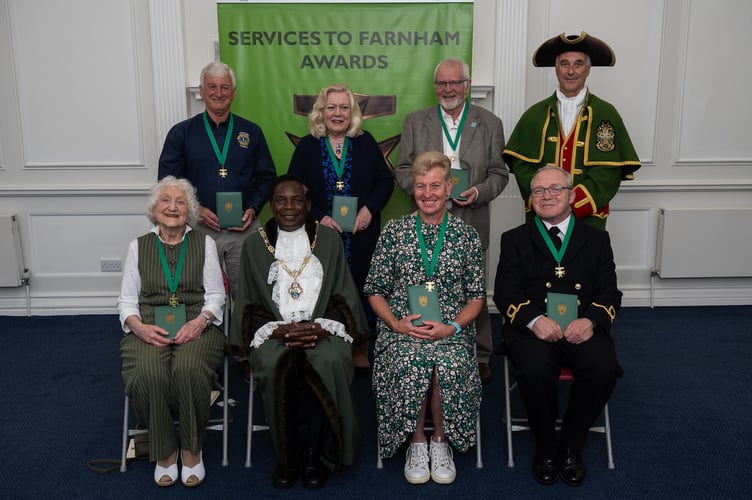 The winners of the Services to Farnham awards 2025 with former mayor Cllr Brodie Mauluka and town crier Michael Stephens.