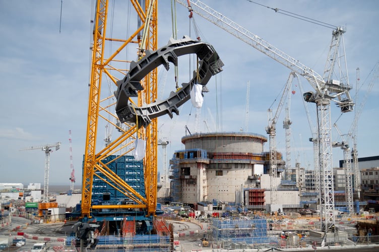 A 54-tonne support ring for the second nuclear reactor is lifted into place at Hinkley Point C.