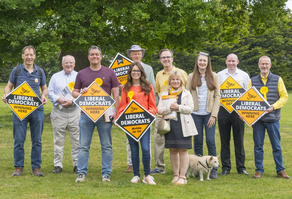 <p>Farnham campaigner Theresa Meredith-Hardy, centre, joins fellow local Liberal Democrats in celebrating the extension of free school meals to more children.</p>