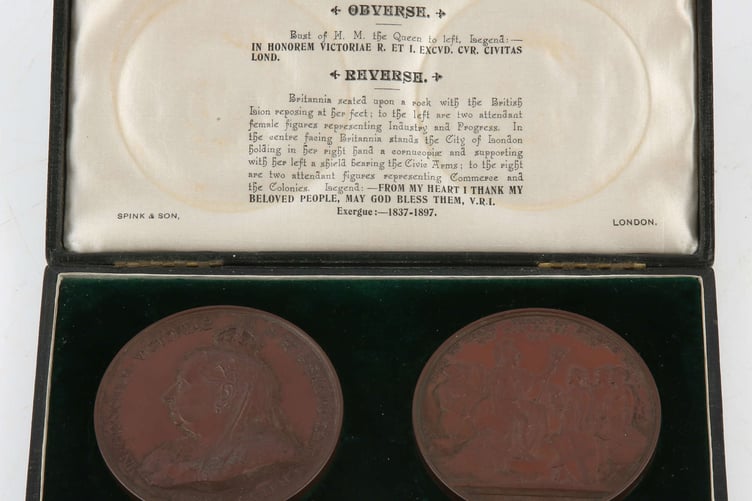 A pair of bronze medals issued to mark the 60th year of the Reign of Queen Victoria.