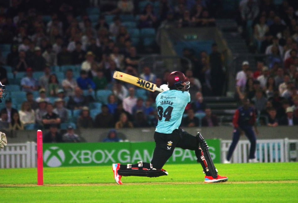 <p>Surrey's Chris Jordan hits the winning four off the last ball of the Vitality Blast match against Kent at the Kia Oval on June 12 (Photo: Mark Sandom).</p>