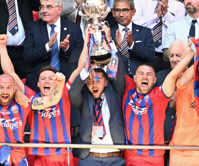 Ollie Harfield lifts the Isuzu FA Trophy at Wembley Stadium, May 11th 2025.