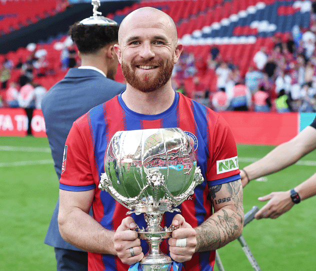 <p>Theo Widdrington with the Isuzu FA Trophy at Wembley (Photo: Ian Morsman).</p>