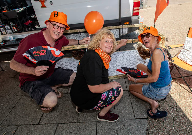 Former mayor Julian Young and his wife Jenny (right), both St Austell town councillors, join Harbour Housing’s ambassador Julie Garrett at the chicken poo bingo stall. (Picture: Paul Williams)
