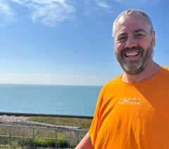 Kevin completes epic cross-Channel swim for hospice care