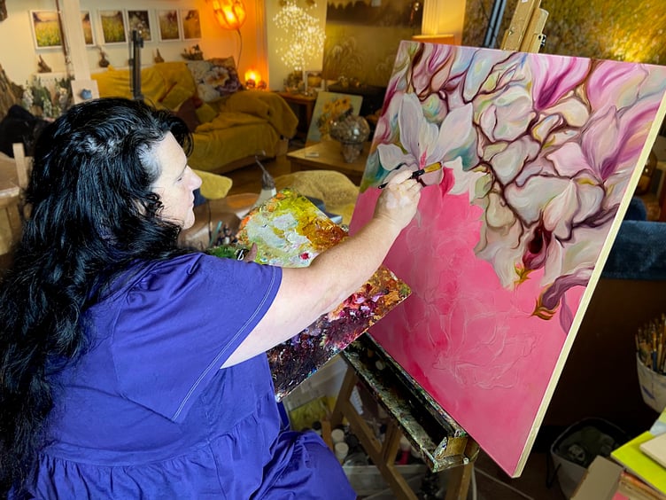 Anita Nowinska painting in her studio
