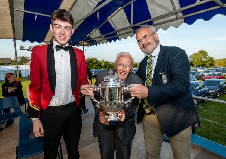 Camborne Town Band won the Royal Trophy. Tom Orchard (Camborne) is shown with festival chairman Graham Ball and festival president and High Sheriff of Cornwall Geraint Richards. (Picture: Paul Williams)