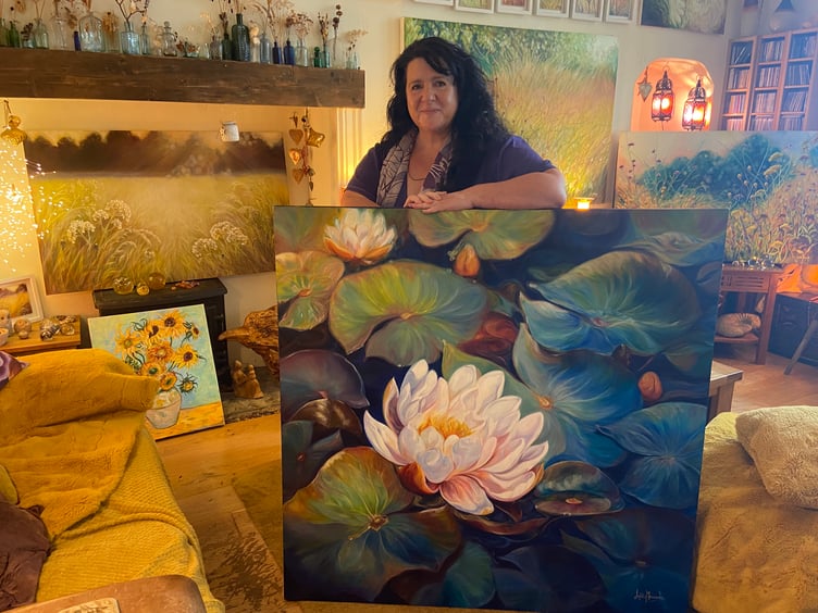Anita Nowinska with her favourite giant waterlily painting named ‘Fortitude’.