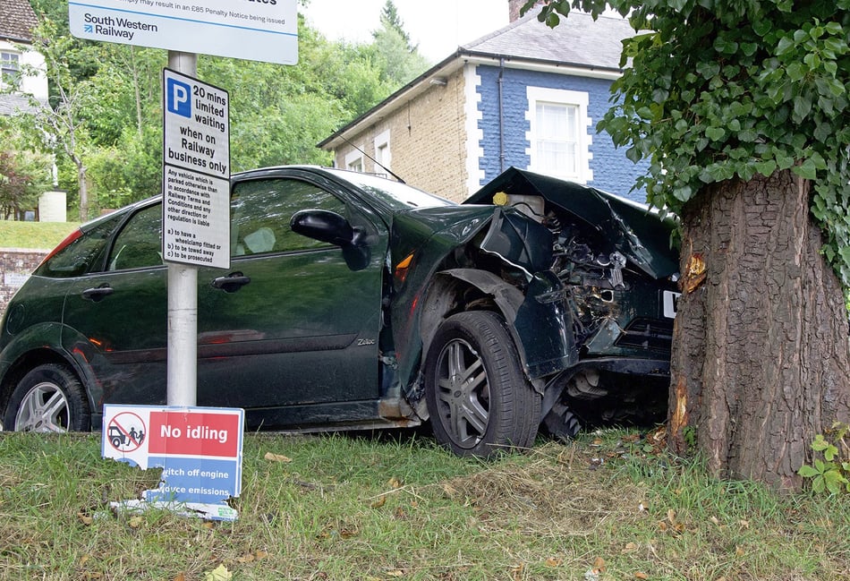 <p>The wrecked Ford Focus after it collided with a tree outside Haslemere station/Credit: JOHN PRICE ARPS LUDSHOTT PHOTOGRAPHIC CLUB </p>