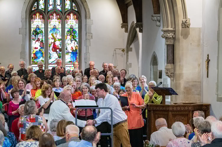 Conductor Richard Pearce is congratulated by composer Owain Park after the performance of the latter’s work Five Nocturnes at Midsummer Nocturnes, St Mary's Church, Frensham, June 22nd 2025.