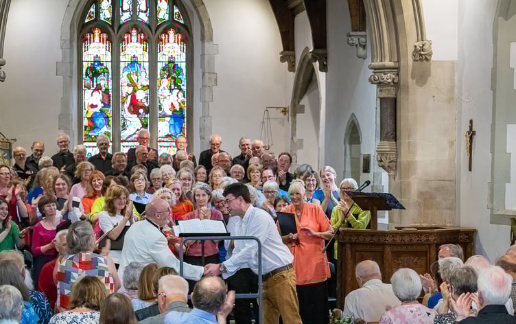 Conductor Richard Pearce is congratulated by composer Owain Park after the performance of the latter’s work Five Nocturnes at Midsummer Nocturnes, St Mary's Church, Frensham, June 22nd 2025.
