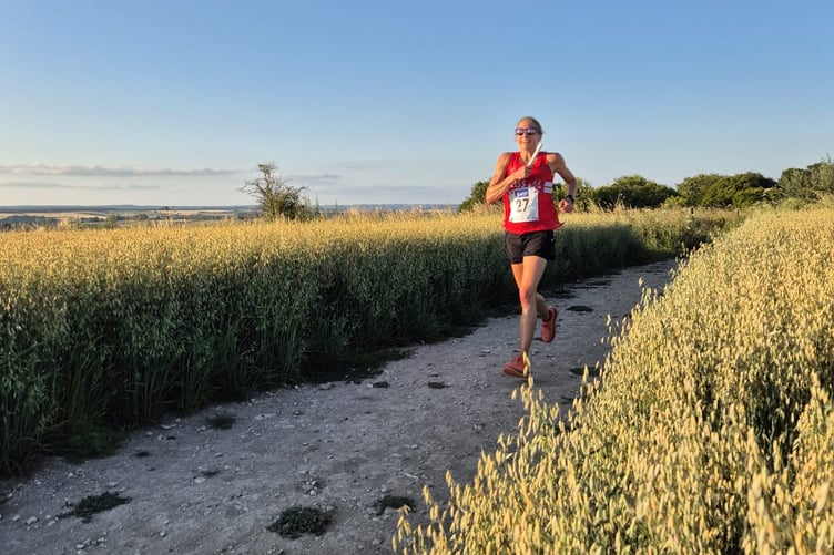 Cari Brown bringing the baton home on leg 18 into Chilcomb