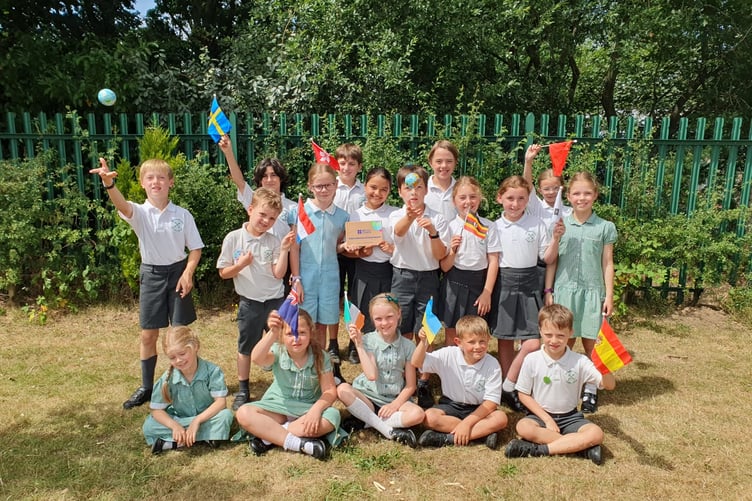 Pupils from St Peter's C of E Primary School in Farnham celebrate the International School Award.