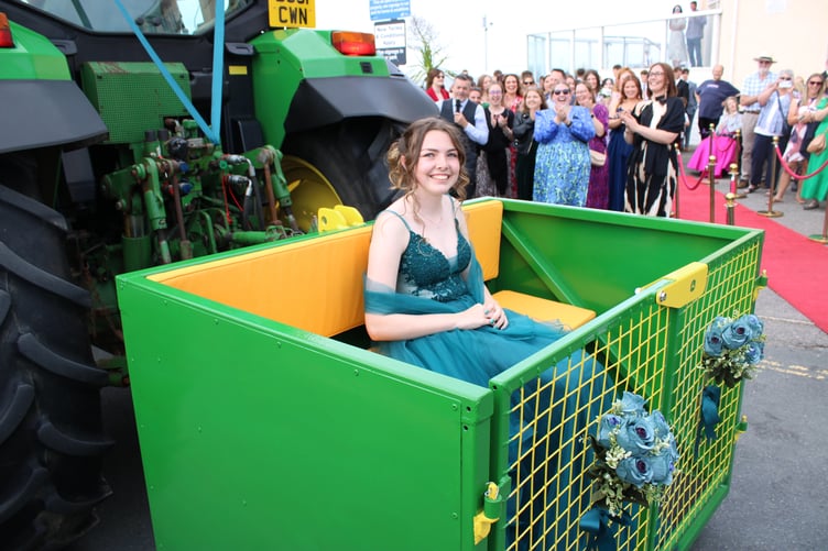 One youngster arriving in the link box of a tractor. (Picture: Brannel School)