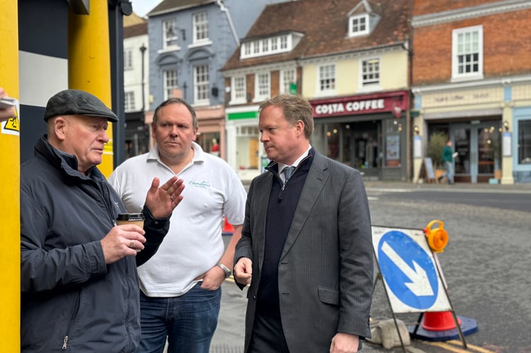 Greg Stafford MP, right, discusses traffic problems in Downing Street with David Quick of Borelli's Wine Bar & Grill, and Steve Hamilton of Hamilton's Tea Room.