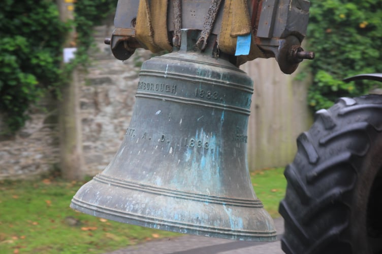 Ladock church bells being loaded onto a tractor
