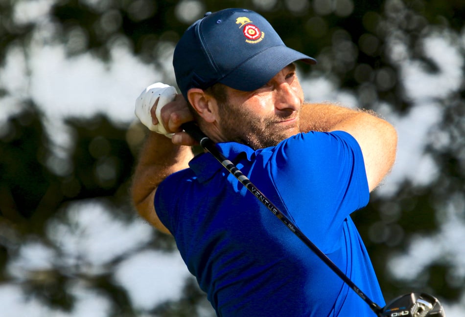 <p>Hayling's Toby Burden tees off at the 15th at Cowdray Park, playing against Sussex in the South East League (Photo: Andrew Griffin/AMG PICTURES)</p>