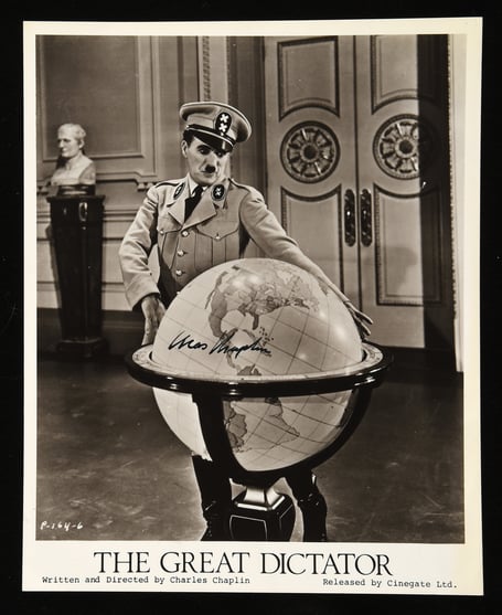A signed photo of Charlie Chaplin in The Great Dictator.