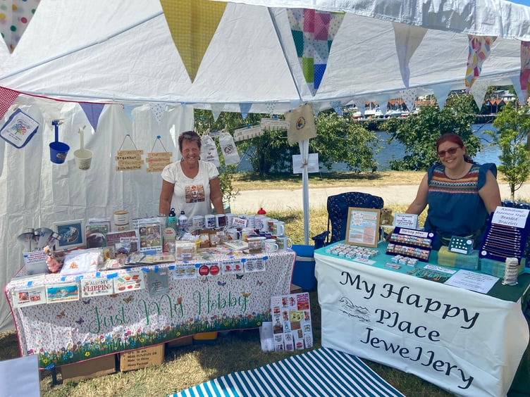 Lyn De La Haye (left) and Sam Ward (right) on their stand at Sky Rise Festival.