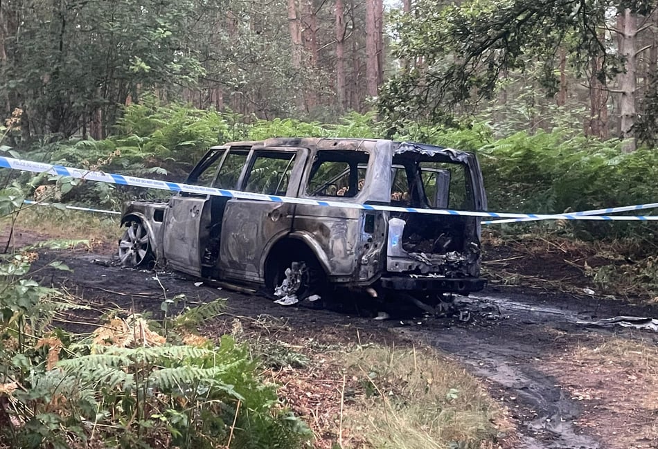 <p>The remains of the burned vehicle in Longmoor. The Range Rover Discovery may have been stolen from a property in Haslemere, with links to a spate of burglaries around East Hampshire.</p>