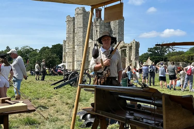 This re-enactor shows off his impressive guns. The Lord Hoptons Regiment of Foote event at Titchfield Abbey.