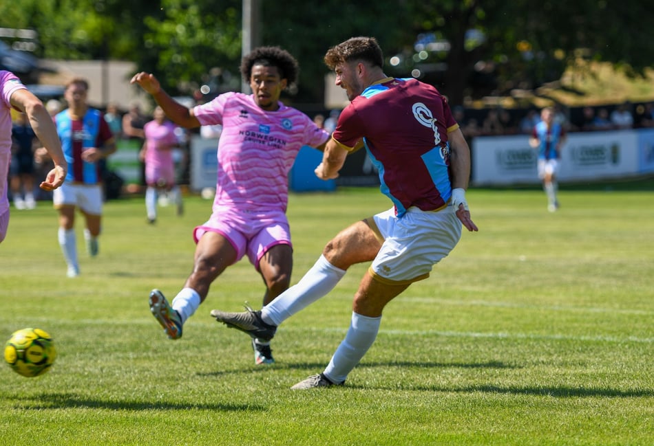 <p>Sam Evans scores Farnham's opening goal against Eastbourne Borough</p>