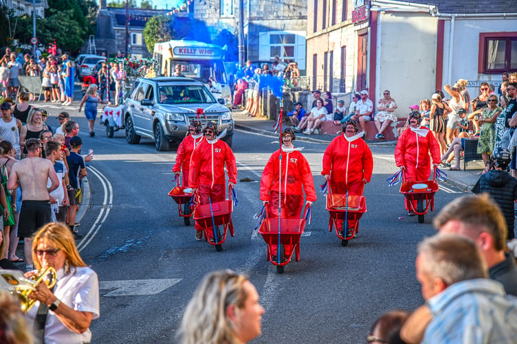 “The Red Barrows” in one of their formations, trailing blue smoke. (Picture: Derek R Williams)