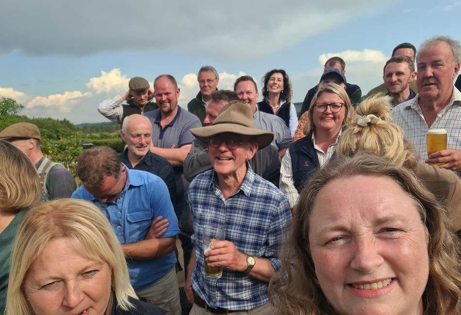 <p>Gwen Woodruffe (bottom right) was part of the 'Farmers' Choir' that sang the praises of Jeremy Clarkson's (above) Hawkstone Lager in the banned advert for the beer.</p>