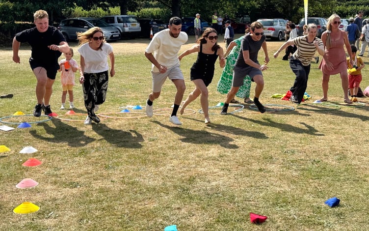 And they're off , the adults novelty race at Fitzhead Fete.
