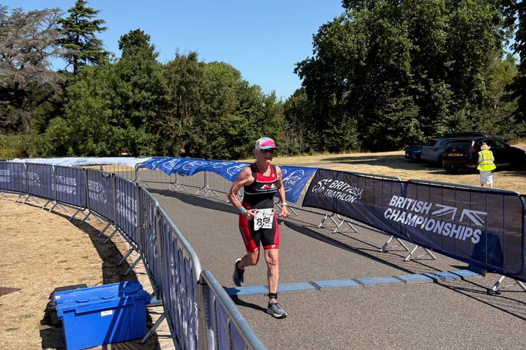 Rose Beddington crossing the finish line