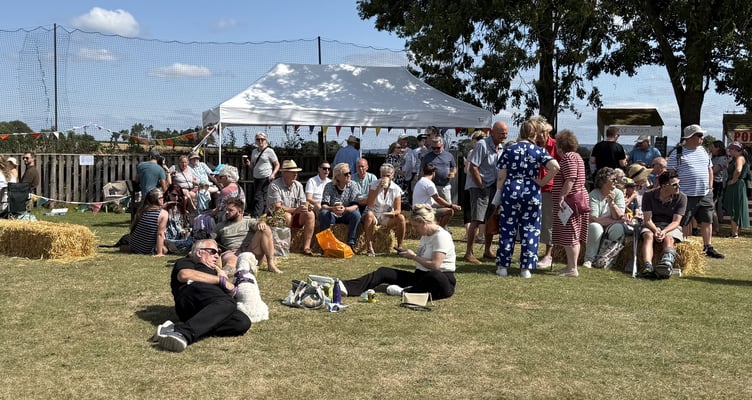 Relaxing in the sun at the beer tent at Fitzhead Fete.