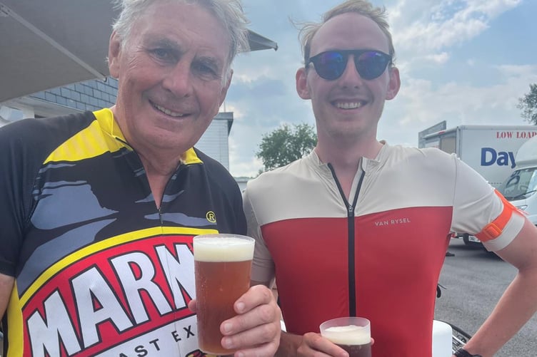 Geoff and Henry having a drinks break after a 75 mile leg