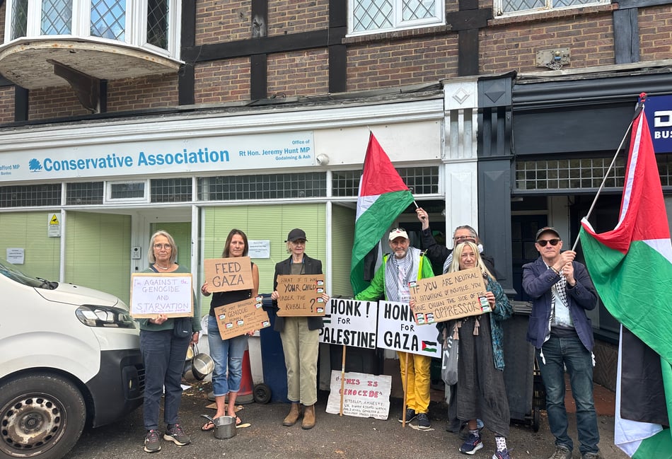 <p>Protesters gathered outside the Hindhead offices of MPs Jeremy Hunt and Greg Stafford, demanding urgent action on Gaza</p>