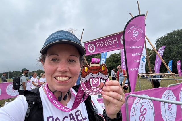 Rachel Deacon proudly shows off her Serpent Trail 50km medal