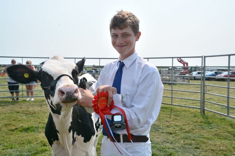 Harry Neale and his bovine are delighted after being among the prize winners. (Picture: Rodney Parrish)