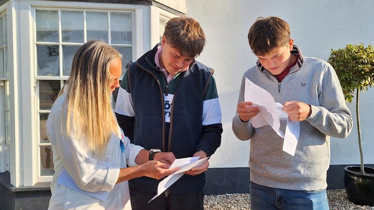 Will Moseby and Matt Hale open their results with teacher Shauna Vetch