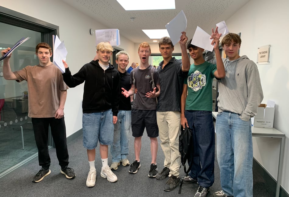 <p>Students from Woolmer Hill celebrate their outstanding GCSE results</p>