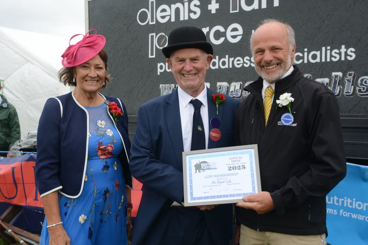 Robert Cole being presented with a life membership by the president of Holsworthy and Stratton Agricultural Show Martyn Mill and his wife. (Picture: Rodney Parrish)